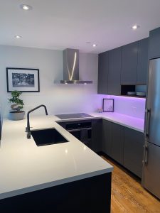 TDM custom cabinet doors are the stunning highlight in the Architect Panel Profile, Door Style 2001, with 07 Edge Profile in matte color finish Moonlight.