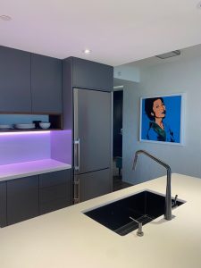 TDM custom cabinet doors are the stunning highlight in the Architect Panel Profile, Door Style 2001, with 07 Edge Profile in matte color finish Moonlight.