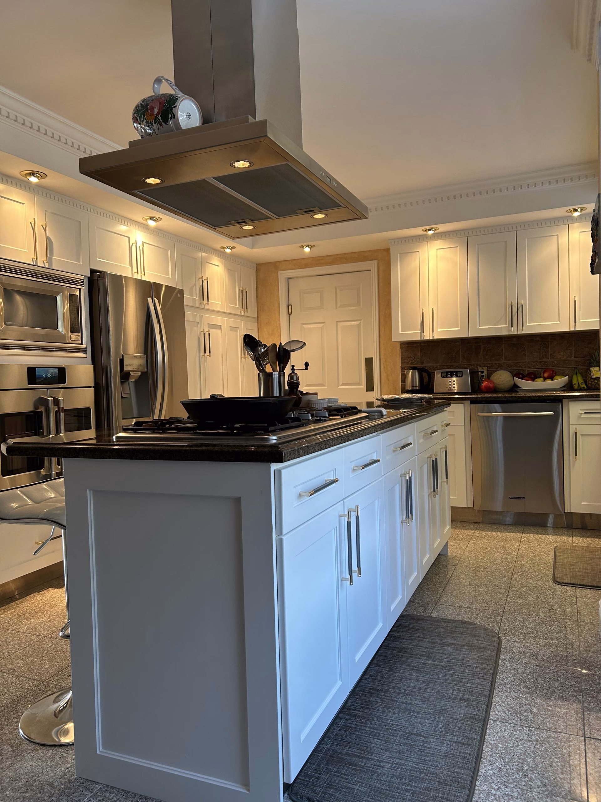 White shaker drawers, doors and gables on kitchen island.