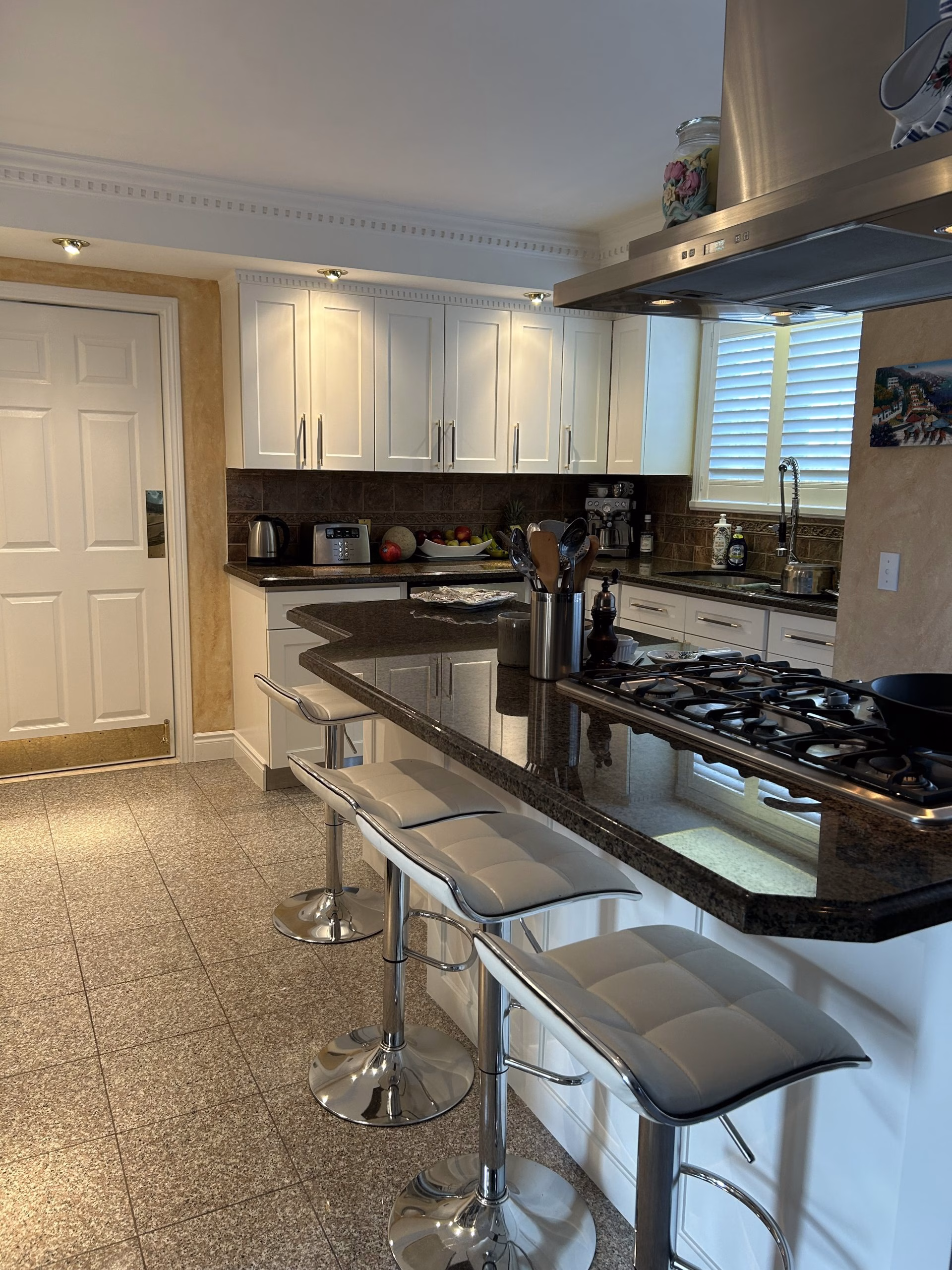 White shaker doors and island gables