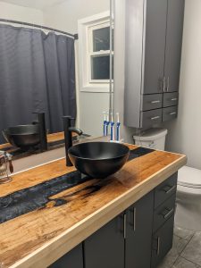 Replacement cabinet door fronts and drawer fronts in the Architect panel profile are featured in bathroom vanity. The door style is 2001 with #4 edge profile.