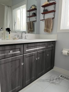 Manhattan Shaker panel profile featured in cabinet door fronts, drawer fronts, and a panel. The 2002 door style is complimented with a #1 edge profile and the slightly textured Grigio grain finish.