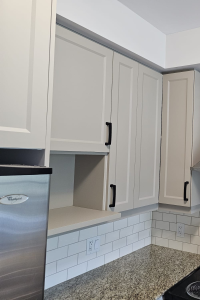 Blue Kitchens Refacing gave TDM's Nouveau Shaker a modern flair with a matte finish in Turmalin.