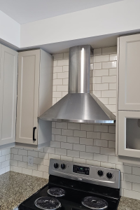 Blue Kitchens Refacing gave TDM's Nouveau Shaker a modern flair with a matte finish in Turmalin.