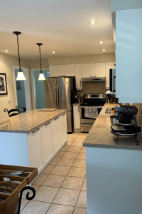 TDM's Inca cabinet door in style 2002 with a 7-edge profile finished in Snow White. By Blue Kitchens Refacing