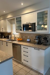 TDM's Inca cabinet door in style 2002 with a 7-edge profile finished in Snow White. By Blue Kitchens Refacing