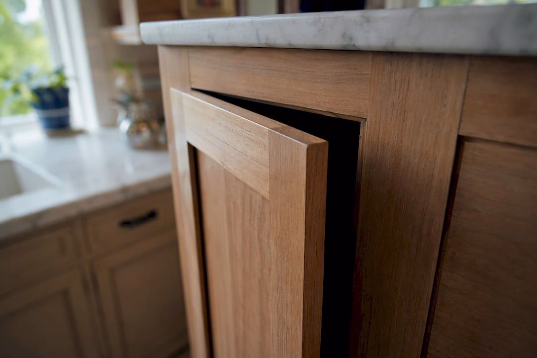 Close-up of wood cabinet door reveal gap